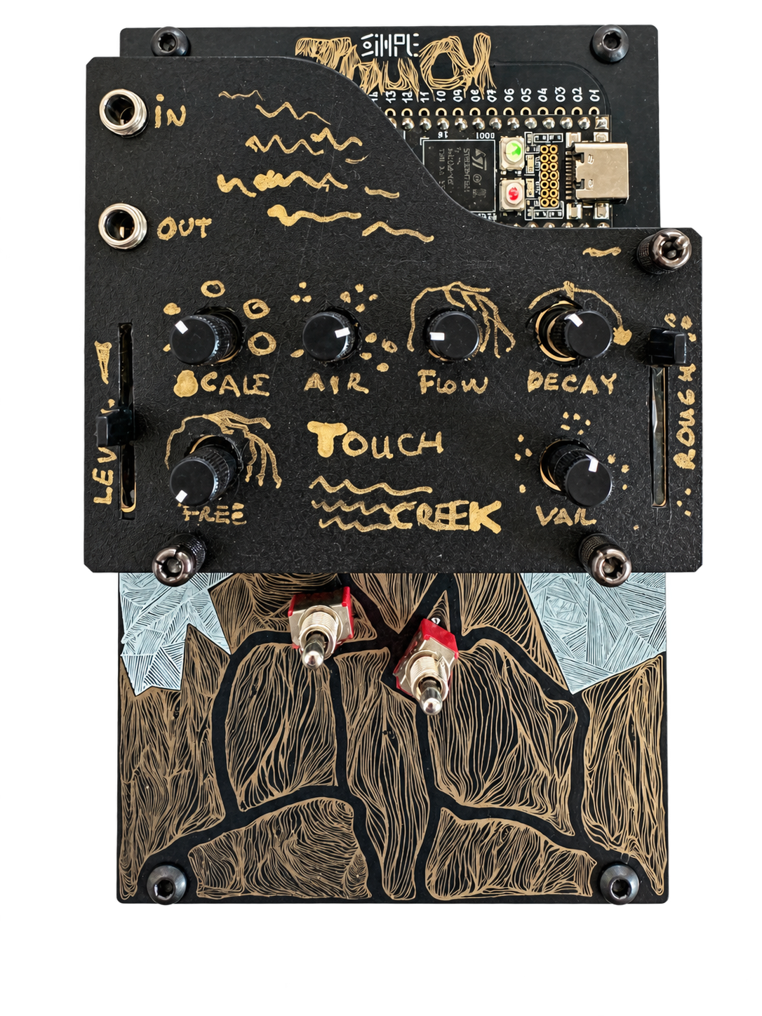 TouchCreek's handmade black and gold faceplate, knobs, faders and illustrated touch surface.